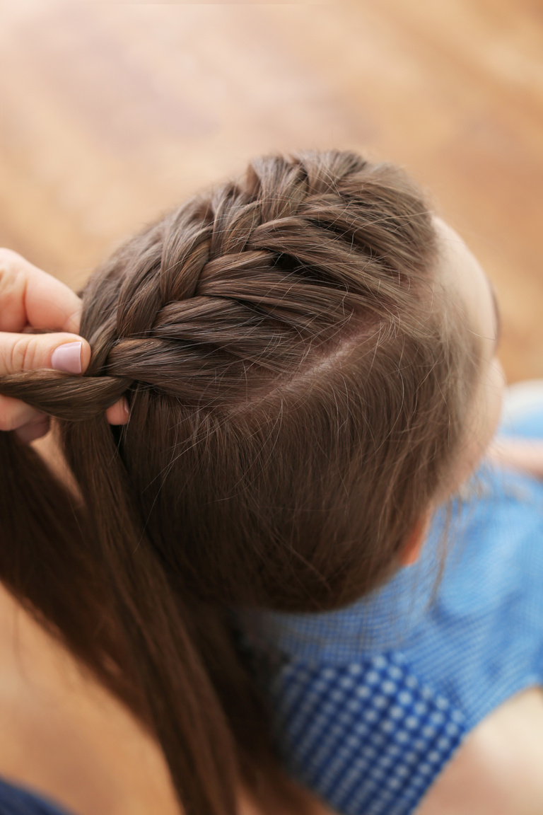 Hairdresser Making Braid Hairstyle